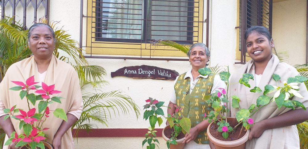 Medical Mission Sr. Rowena Miranda, center, stands with sisters in front of the convent at the eco-health center Samanvaya. (Courtesy of Rowena Miranda)