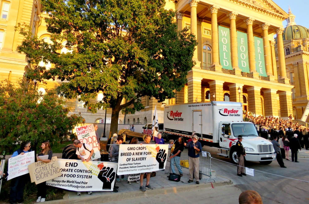 The Occupy the World Food Prize group protests within sight and sound of the Iowa Capitol building during the presentation of the World Food Prize on Oct. 19 in Des Moines. (Aaron Jorgensen-Briggs)