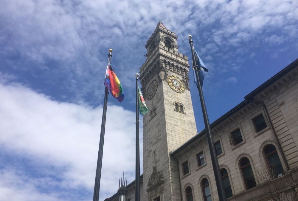 The progressive pride flag, at left, flies over city hall in Worcester, Massachusetts. (Courtesy of Guillermo Creamer Jr.)