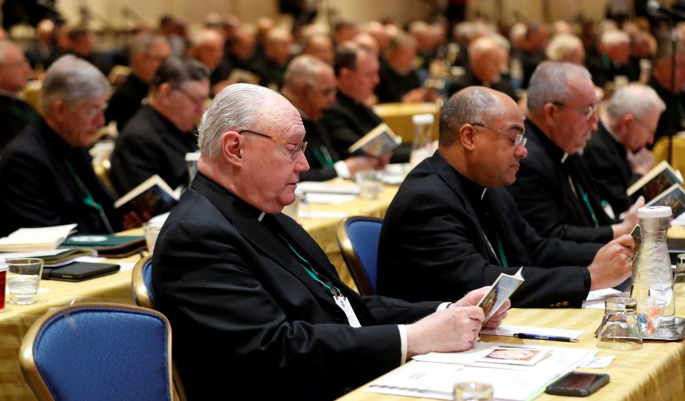 Several bishops pray during a Nov. 12, 2018, session of the U.S. Conference of Catholic Bishops' fall general assembly in Baltimore. (CNS/Reuters/Kevin Lamarque)