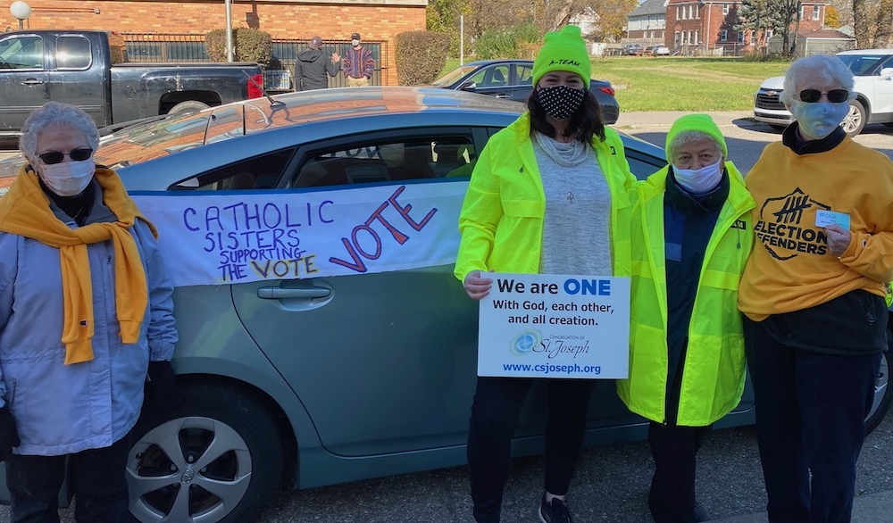 From left: St. Joseph Srs. Cathy Desantis, Erin McDonald, Nina Rodriguez and Marcella Clancy support the vote in Detroit Nov. 3. (Courtesy of Sr. Erin McDonald, CSJ) From left: St. Joseph Srs. Cathy Desantis, Erin McDonald, Nina Rodriguez and Marcella Clancy support the vote in Detroit Nov. 3. (Courtesy of Sr. Erin McDonald, CSJ)
