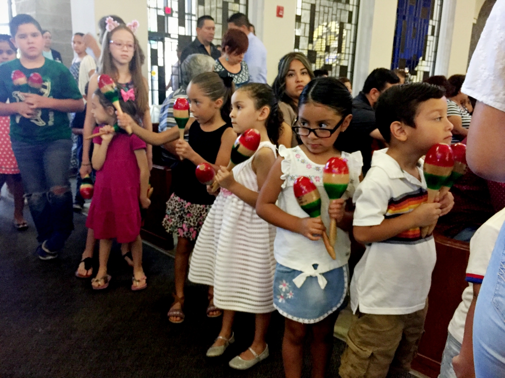 A Mass at St. Mark Church in El Paso, Texas, begins with children leading the procession with maracas. (NCR photo/Soli Salgado)