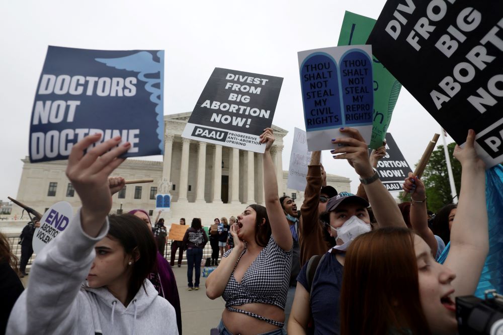 Abortion demonstrators are seen outside the U.S. Supreme Court in Washington May 3. Demonstrations followed the leak of a draft majority opinion written by Justice Samuel Alito preparing for a majority of the court to overturn the landmark Roe. 