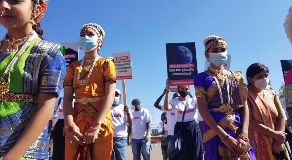 A group of Hindu women join a march in Ngong, Kenya, outside Nairobi as part of "Sacred People, Sacred Earth" demonstrations around the world March 11. Organizers called it the largest day of multifaith actions pressuring governments and banks to enact 10