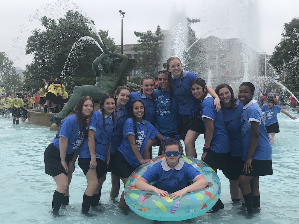 Hallahan students celebrate the end of the school year in spring 2019 by jumping into the Logan Square Fountain, a tradition that dates back more than 50 years. (Courtesy of Kim Kimrey)