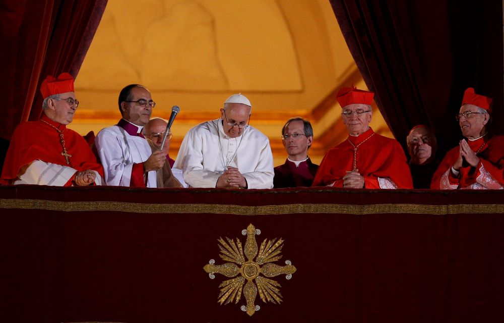 Pope Francis leads a prayer as he appears for the first time on the central balcony of St. Peter's Basilica at the Vatican March 13, 2013.