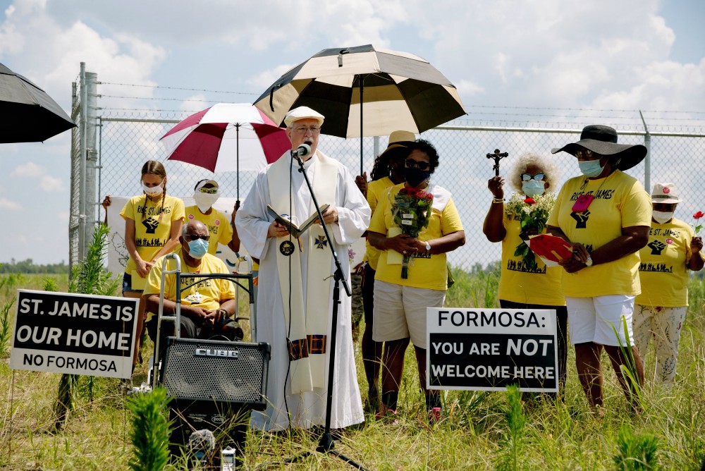 Fr. Vincent Dufresne prays at the Formosa site during a 2020 Juneteenth commemoration hosted by Rise St. James. (Courtesy of Louisiana Bucket Brigade/Bron Moyi) Fr. Vincent Dufresne prays at the Formosa site during a 2020 Juneteenth commemoration hosted by Rise St. James. (Courtesy of Louisiana Bucket Brigade/Bron Moyi)