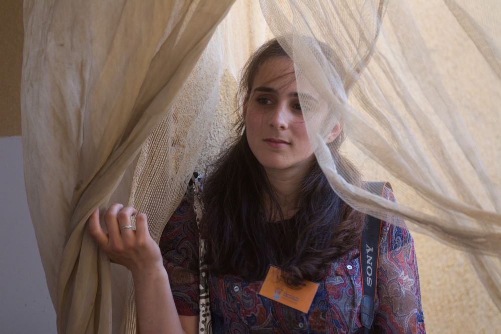 A member of a Pax Christi delegation listens to a presentation during a visit in Fasayel, West Bank, in this May 15, 2015 file photo. (CNS/Miriam Alster)