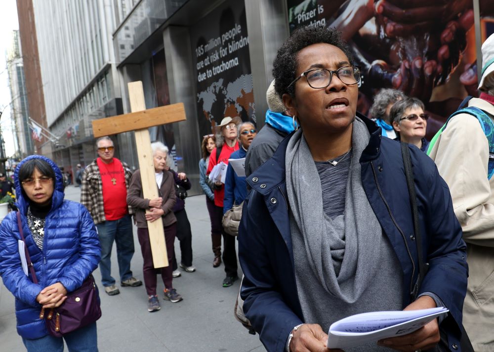 Flore Berger prays during the 35th annual Pax Christi Metro New York Way of the Cross/Way of Peace April 14, 2017, in New York City. "Jesus Calls Us to Active Nonviolence" was the theme of the year's Good Friday commemoration. (CNS/Gregory A. Shemitz)