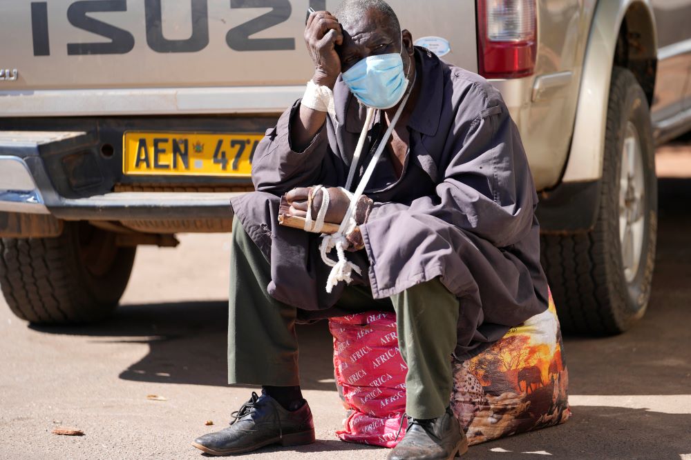 A man sits after being refused medical assistance at Parirenyatwa Hospital in Harare, Zimbabwe, June 21. A strike by health workers has left Zimbabwe's major hospitals in near paralysis. (AP/Tsvangirayi Mukwazhi)