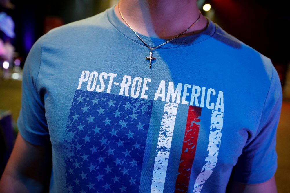 A student wears a crucifix and a pro-life T-shirt during a July 22 Turning Point USA Student Action Summit in Tampa, Florida. (CNS/Reuters/Marco Bello)