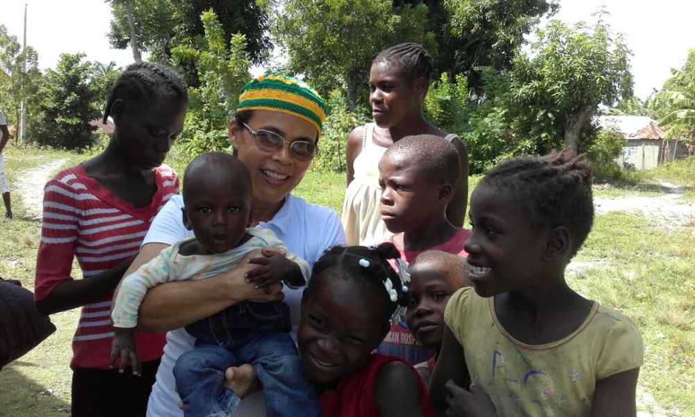 Carmelite Sr. Ideneide Rêgo, pictured here with children in Port-au-Prince, has been working in Haiti since 2014 as part of the Brazilian bishops' inter-congregational mission in the country. (Courtesy of Sr. Ideneide Rêgo)