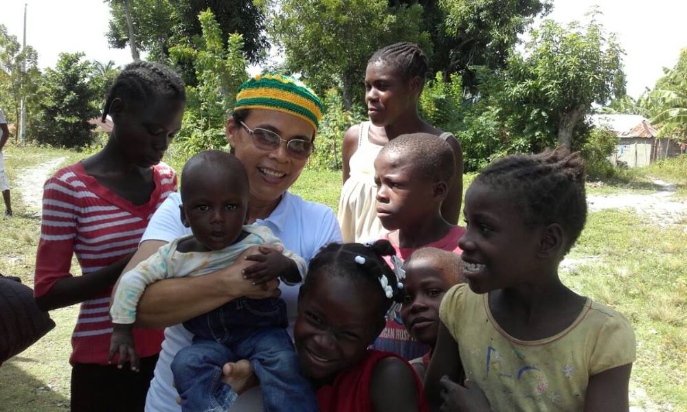 Carmelite Sr. Ideneide Rêgo, pictured here with children in Port-au-Prince, has been working in Haiti since 2014 as part of the Brazilian bishops' inter-congregational mission in the country. (Courtesy of Sr. Ideneide Rêgo)