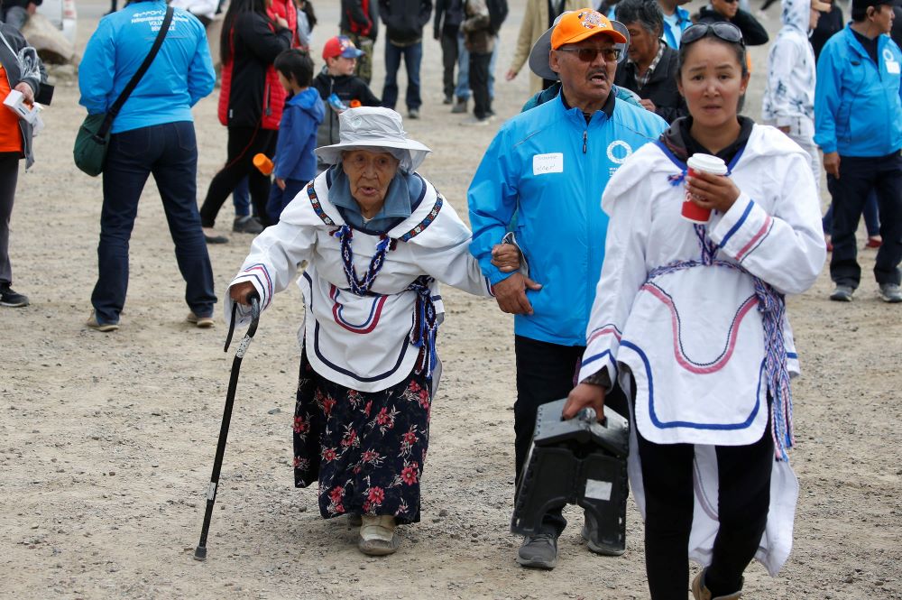 An older woman arrives for Pope Francis' meeting with young people and elders outside the primary school in Iqaluit in the Canadian territory of Nunavut July 29.