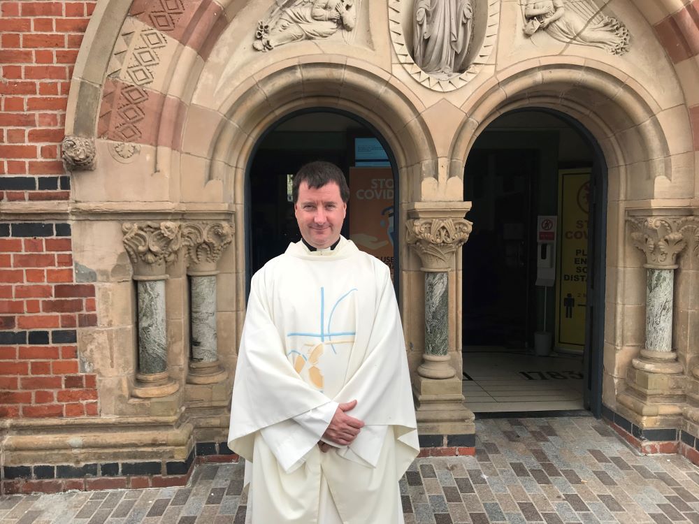 Fr. Darach MacGiolla Cathain, shown here at St Mary's Chapel Lane, was born and raised in Shaw's Road, a West Belfast Irish speaking community his parents helped to establish. (NCR/Claude Colart)