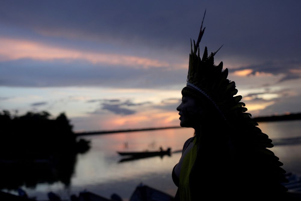 A leader of the Celia Xakriaba peoples walks along the banks of the Xingu River in Brazil's Xingu Indigenous Park Jan. 15, 2020. 
