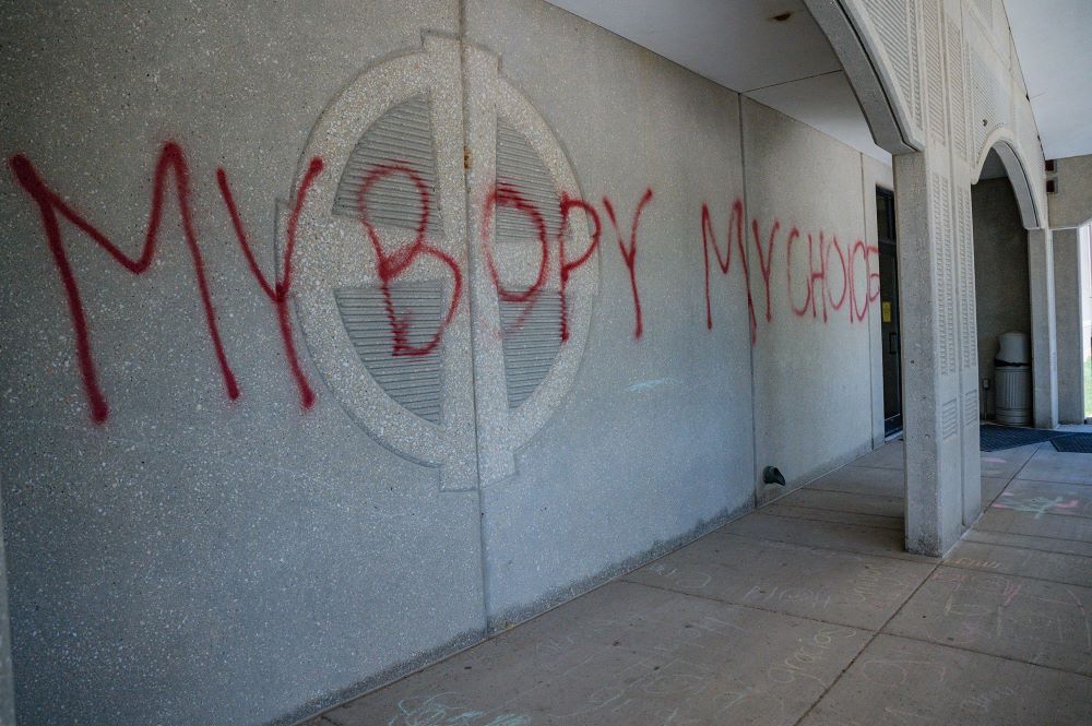 Graffiti that supports abortion rights is seen on a wall of the Church of the Ascension in Overland Park, Kansas, July 10. Kansas voters on Aug. 2 rejected a ballot measure that would have allowed the legislature to outlaw abortion.