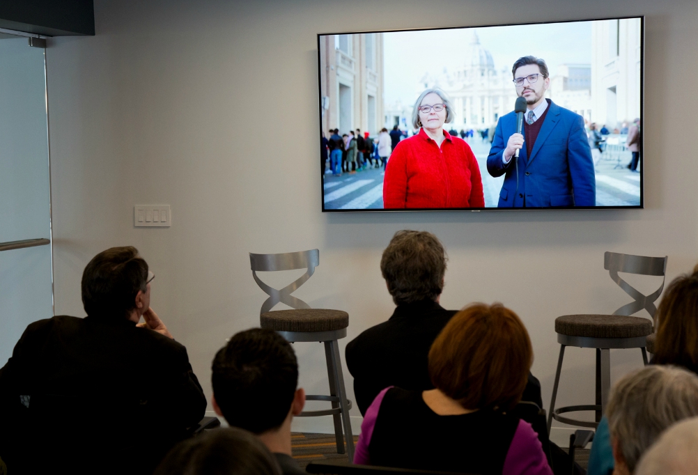Cindy Wooden and Joshua McElwee, Rome correspondents for Catholic News Service and NCR, respectively, speak in a welcome video at the March 13 panel discussion of "A Pope Francis Lexicon." (Center of Concern/Michael Carpenter Photography)