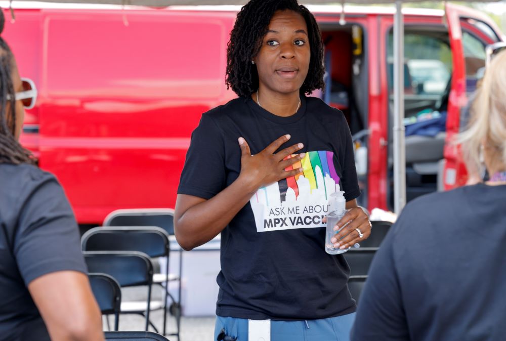 Tyler Green, preparedness help manager with the Mecklenburg County Public Health Department, talks to volunteers at a monkeypox vaccination clinic in Charlotte, N.C., Aug. 20. (AP/Nell Redmond)