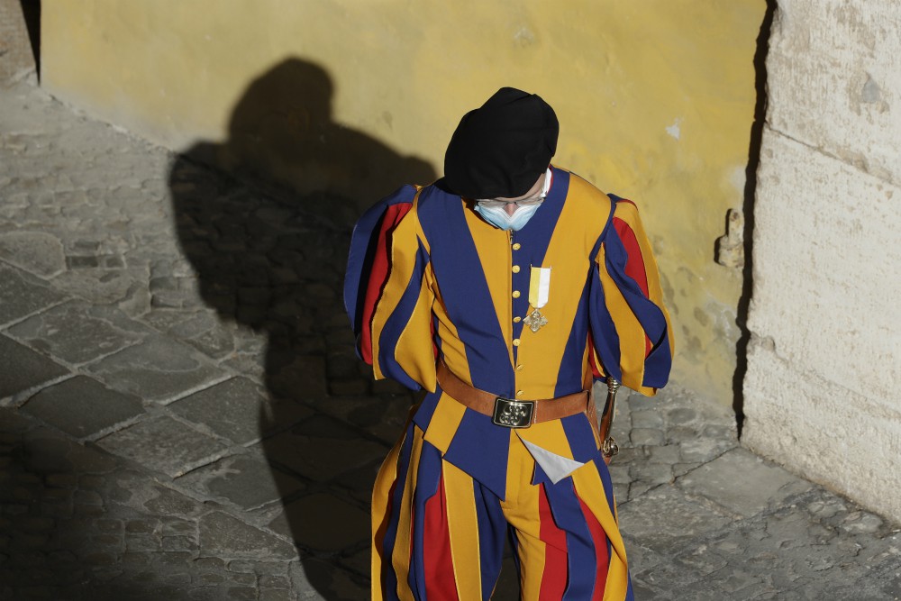 A Vatican Swiss Guard wears a face mask to prevent the spread of COVID-19 in the San Damaso courtyard ahead of Pope Francis' general audience Sept. 2 at the Vatican. (AP Photo/Andrew Medichini, file) A Vatican Swiss Guard wears a face mask to prevent the spread of COVID-19 in the San Damaso courtyard ahead of Pope Francis' general audience Sept. 2 at the Vatican. (AP Photo/Andrew Medichini, file)
