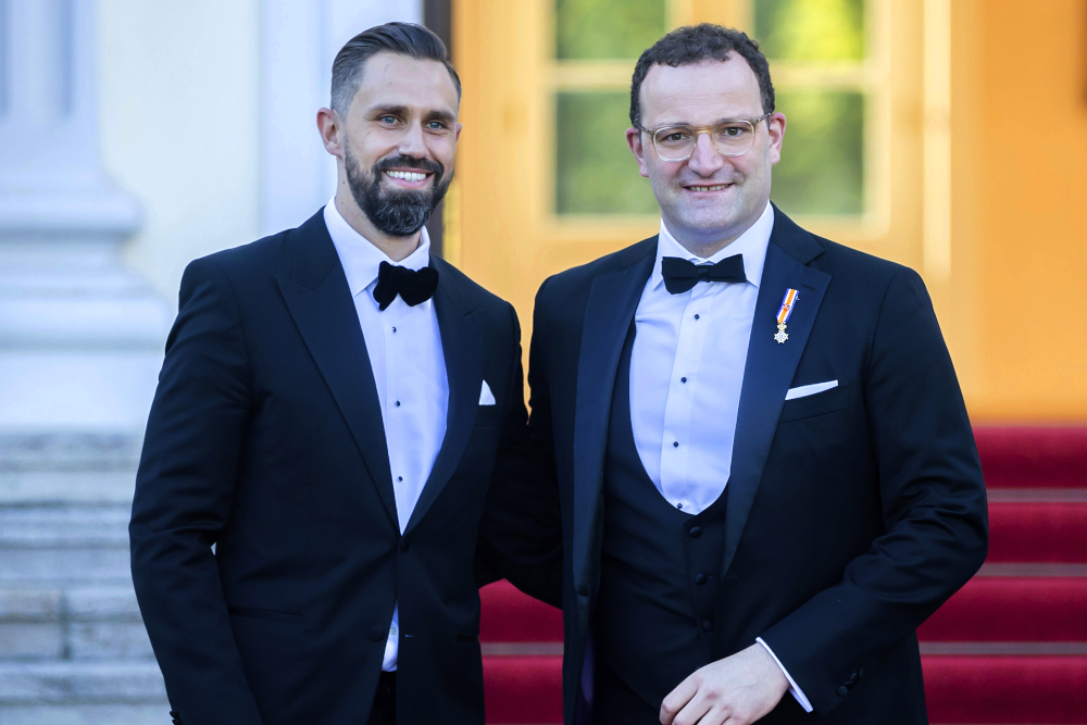 German Health Minister Jens Spahn, right, and his husband Daniel Funke, left, arrive July 5 at Bellevue presidential palace to attend a state banquet hosted by the federal president and his wife in Berlin. (AP/Christoph Soeder)