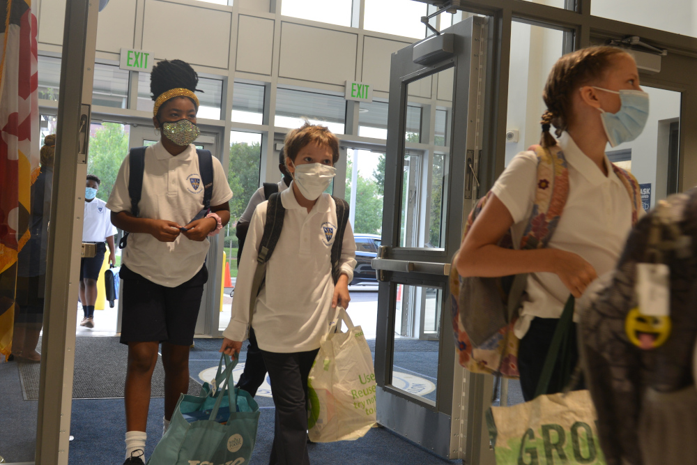 School-aged children enter the first new Catholic school built in Baltimore in roughly 60 years on Aug. 30. (AP/David McFadden)