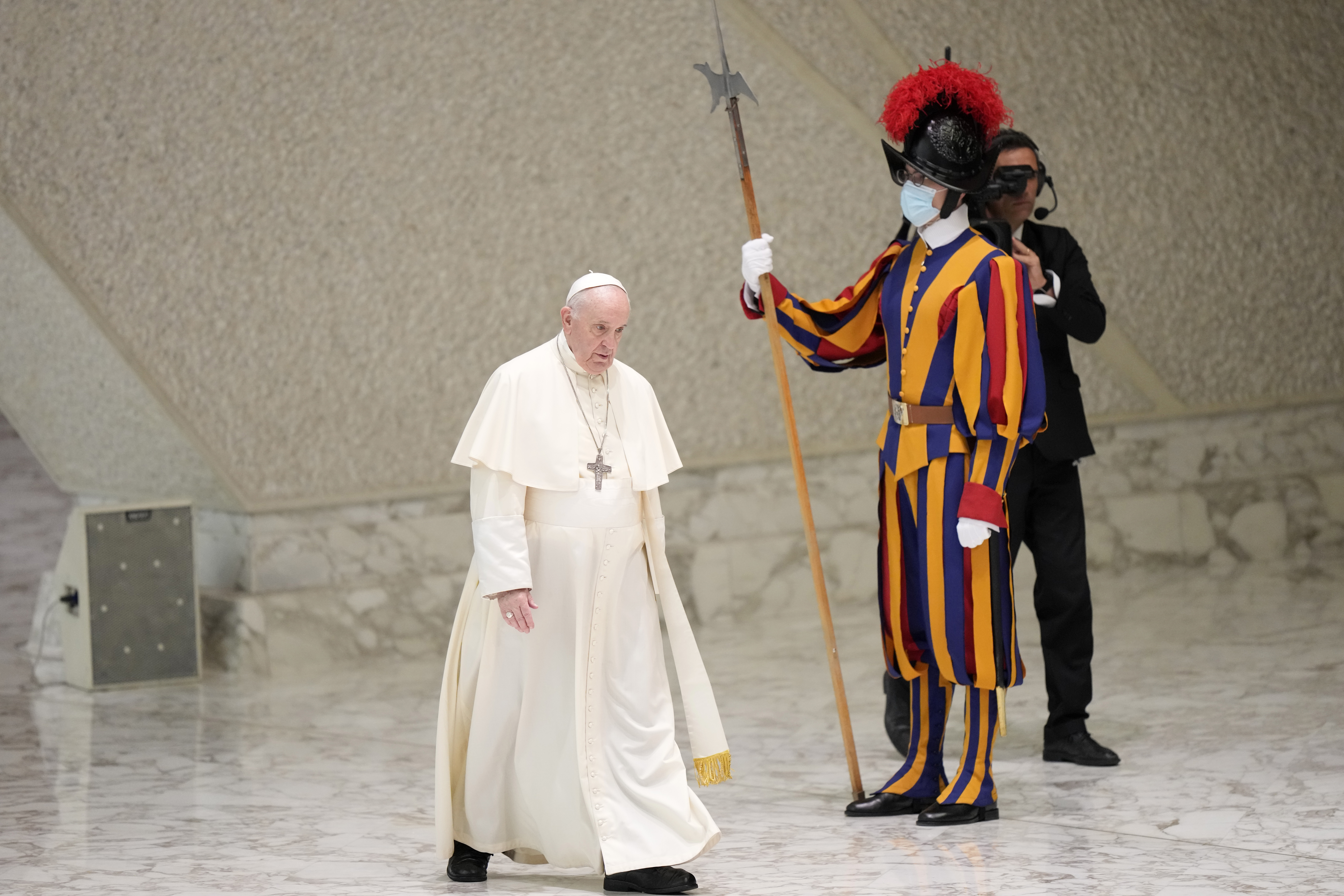 Pope Francis walks past a Vatican Swiss Guard as he arrives for his weekly general audience in the Paul VI hall, at the Vatican, Wednesday, Sept. 8, 2021. (AP Photo/Andrew Medichini) Pope Francis walks past a Vatican Swiss Guard as he arrives for his weekly general audience in the Paul VI hall, at the Vatican, Wednesday, Sept. 8, 2021. (AP Photo/Andrew Medichini)