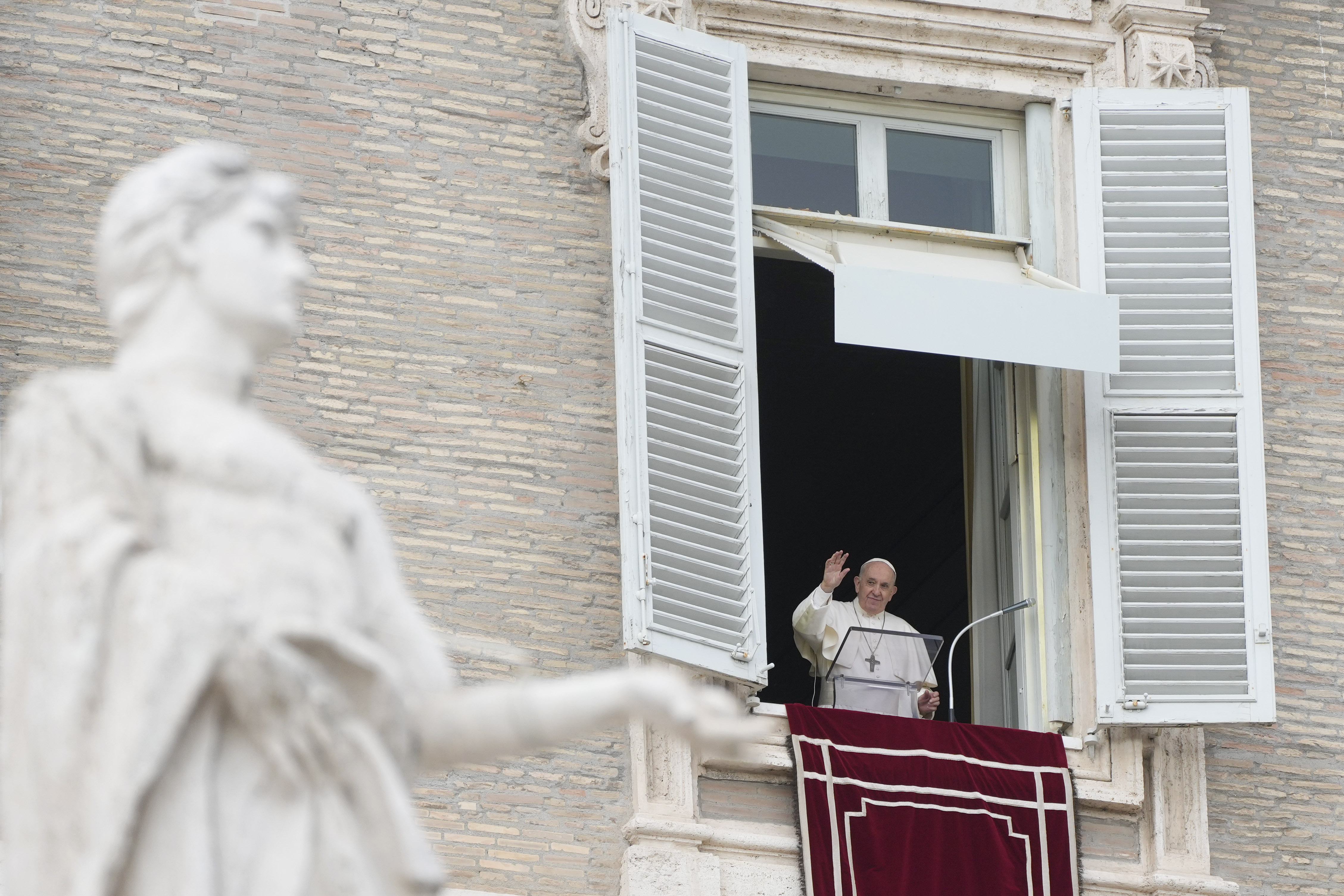 Pope Francis waves to faithful on the occasion of the Angelus noon prayer in St. Peter's Square, at the Vatican, Sunday, Nov. 14, 2021. (AP Photo/Gregorio Borgia) Pope Francis waves to faithful on the occasion of the Angelus noon prayer in St. Peter's Square, at the Vatican, Sunday, Nov. 14, 2021. (AP Photo/Gregorio Borgia)