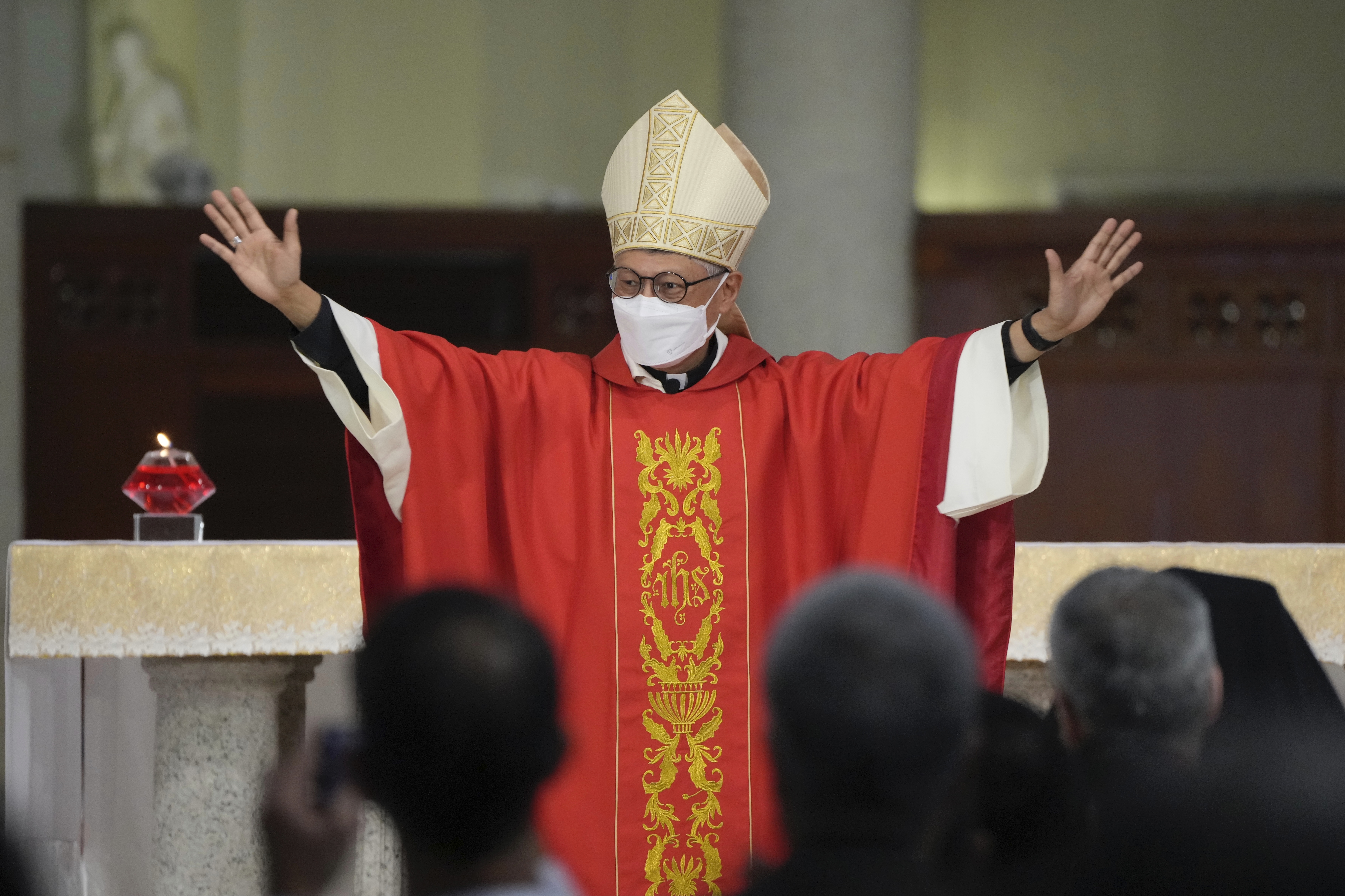 Stephen Chow waves at the episcopal ordination ceremony as the new Bishop of the Catholic Diocese, in Hong Kong, Saturday, Dec. 4, 2021. (AP Photo/Kin Cheung) Stephen Chow waves at the episcopal ordination ceremony as the new Bishop of the Catholic Diocese, in Hong Kong, Saturday, Dec. 4, 2021. (AP Photo/Kin Cheung)