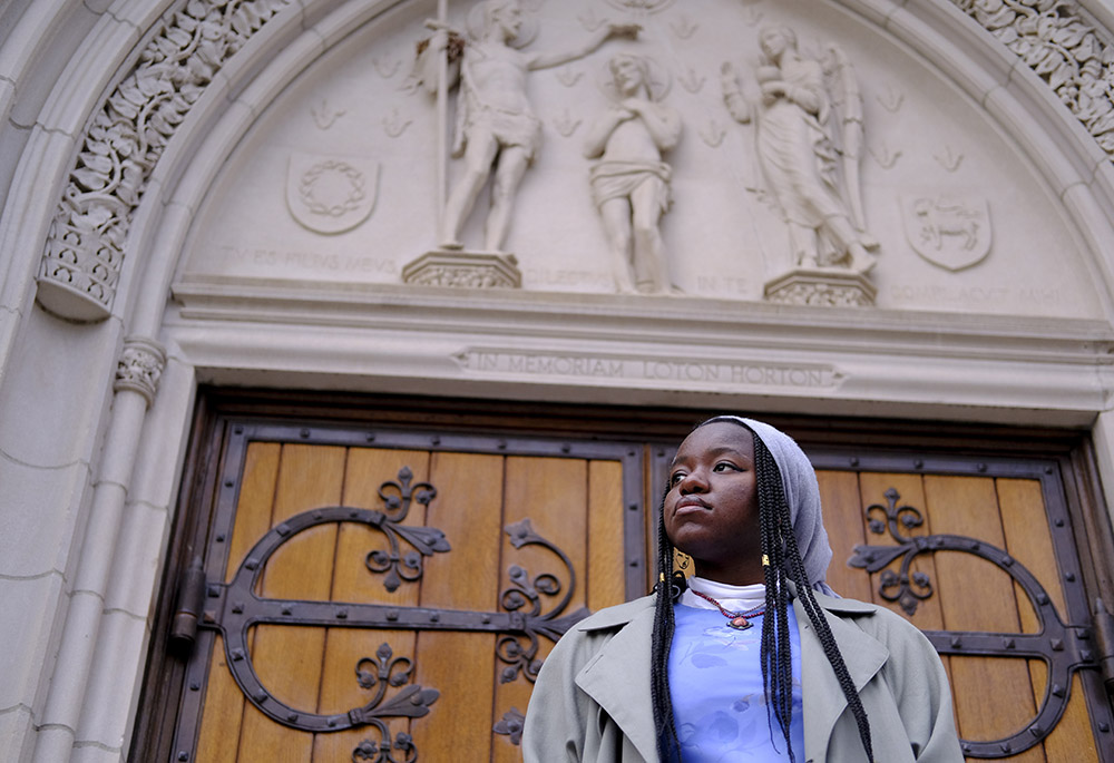 Nathalie Charles poses for a portrait outside the Princeton University Chapel Dec. 8 in Princeton, New Jersey. (AP photo/Luis Andres Henao)