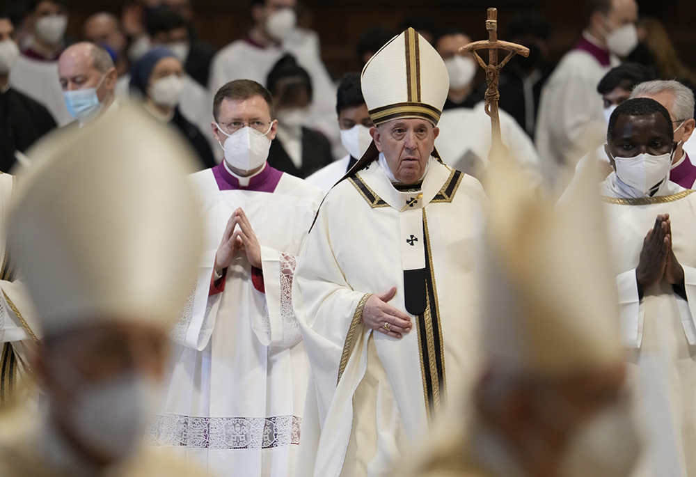 Pope Francis walks with his pastoral staff among Cardinals and prelates wearing FFP2 masks at the end of an Epiphany Mass in St. Peter's Basilica Jan. 6 at the Vatican. (RNS/AP/Gregorio Borgia) Pope Francis walks with his pastoral staff among Cardinals and prelates wearing FFP2 masks at the end of an Epiphany Mass in St. Peter's Basilica Jan. 6 at the Vatican. (RNS/AP/Gregorio Borgia)