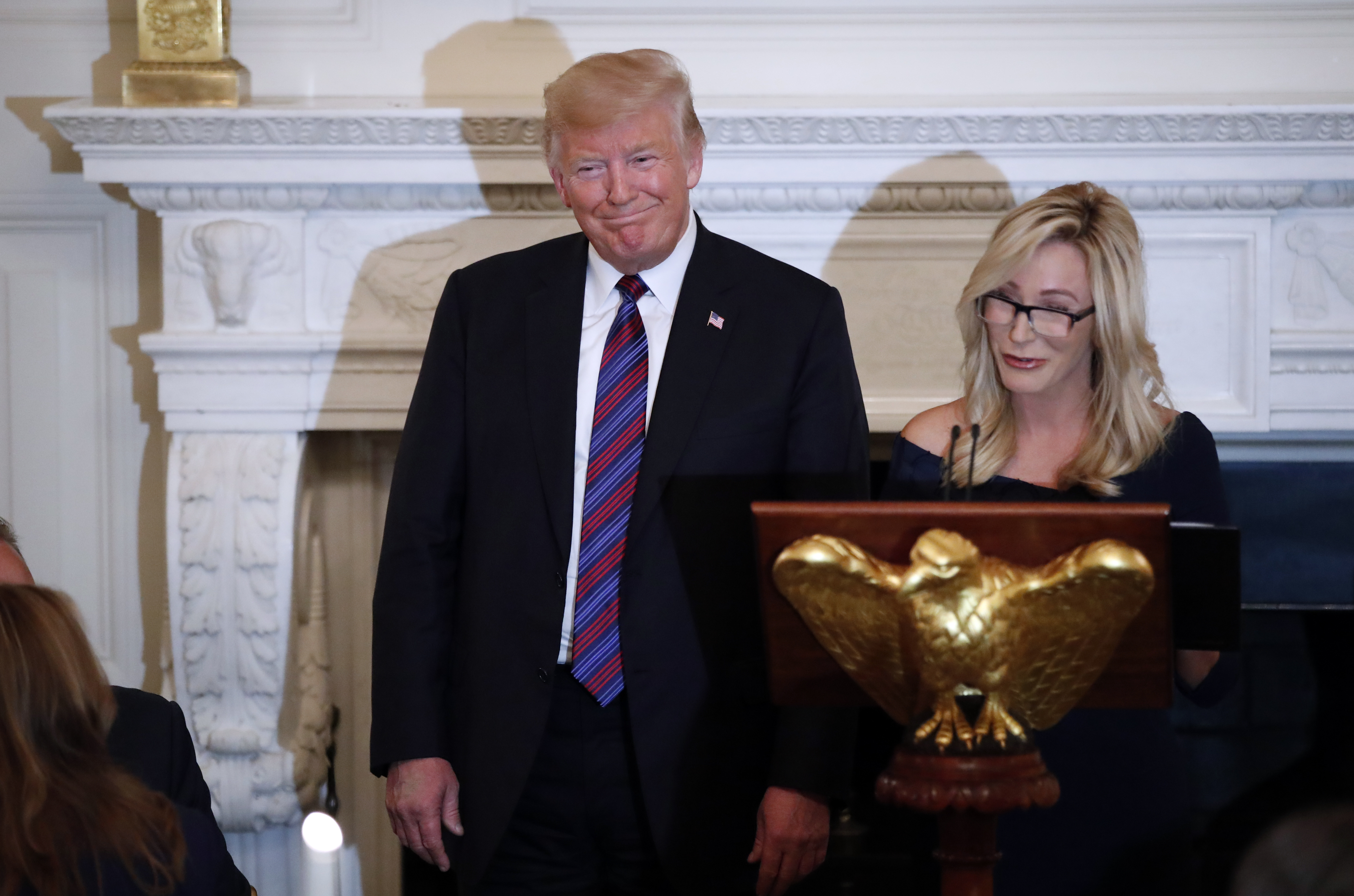 Then-President Donald Trump with pastor Paula White at a dinner for evangelical leaders in the State Dining Room of the White House, Aug. 27, 2018, in Washington. (AP/Alex Brandon)