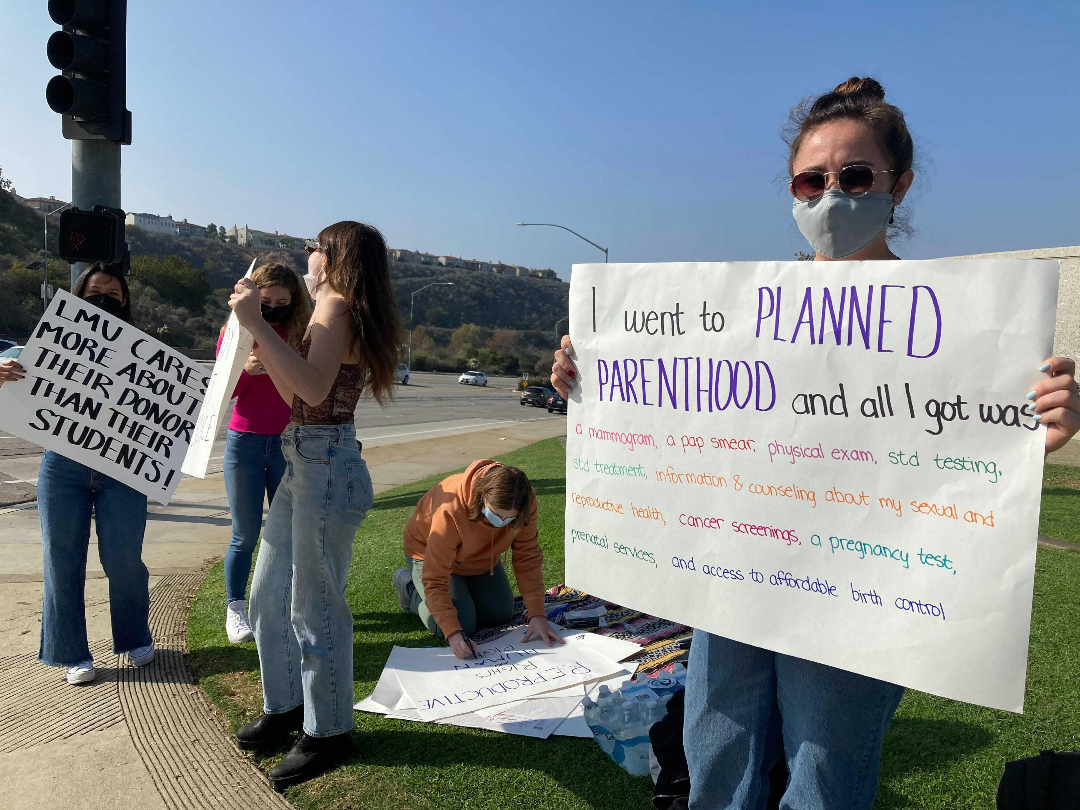 Nicole Baxley, right, a senior at Loyola Marymount University, organized a protest Wednesday, Nov. 17, 2021. (RNS photo by Alejandra Molina)