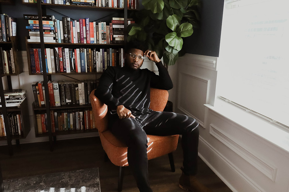 Author Danté Stewart in his office (RNS/CrownedGold Photography/Taja Ambrose)