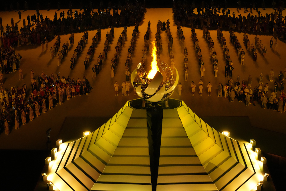 The Olympic flame burns July 23 during the opening ceremony in the Olympic Stadium at the 2020 Summer Olympics in Tokyo, Japan. (AP/Lee Jin-man)