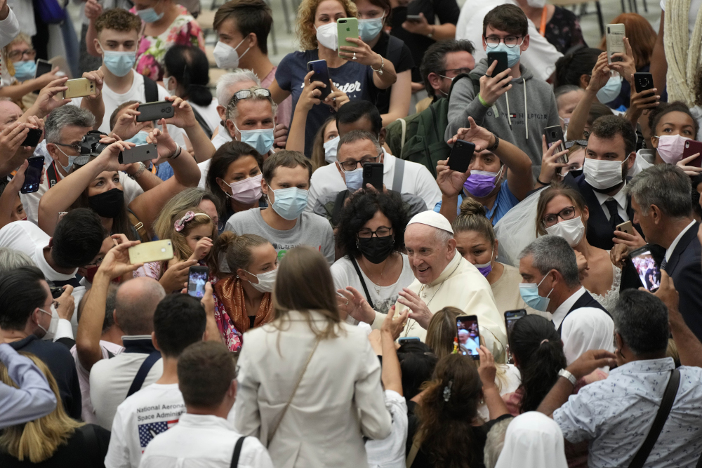 Pope Francis stops to greet the faithful as he leaves after the Aug. 25 weekly general audience at the Vatican. (AP/Gregorio Borgia)