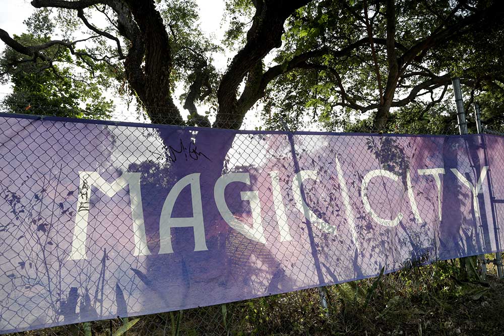 A sign on a fence in 2019 advertises the future Magic City Innovation District set to be built in the Little Haiti neighborhood of Miami. (AP/Lynne Sladky)