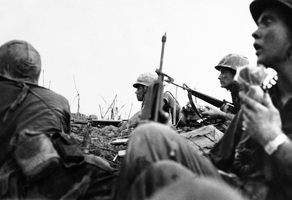 In a photo taken by French photojournalist Catherine Leroy, U.S. Marines get ready for a final assault on a hilltop in northwestern Vietnam on May 3, 1967. (AP/Catherine Leroy)