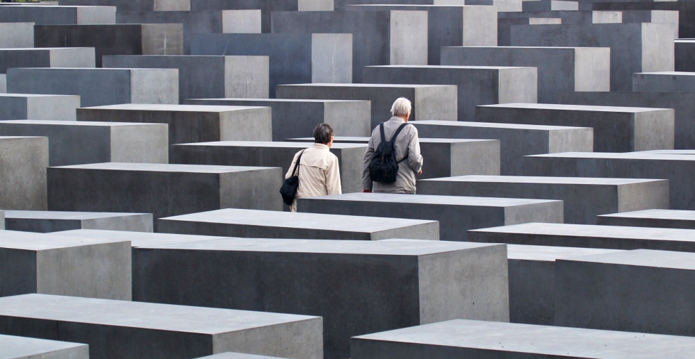 A couple walks through the Memorial to the Murdered Jews of Europe in Berlin. (Wikimedia Commons) A couple walks through the Memorial to the Murdered Jews of Europe in Berlin. (Wikimedia Commons)