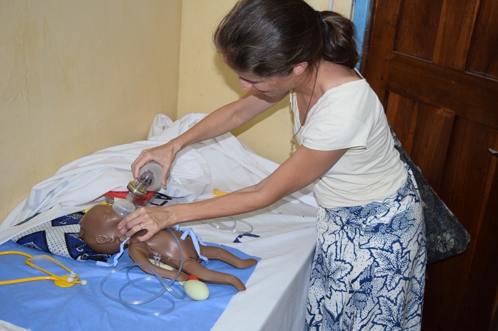 Maryknoll Lay Missioner Anne Berry demonstrates emergency care in the skills lab at Bukumbi Hospital's maternity ward in Tanzania.