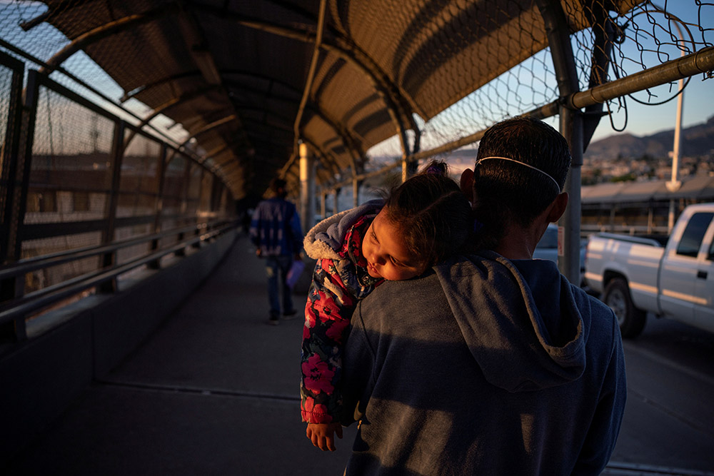 A Honduran immigrant near El Paso, Texas, who is affected by the U.S. Migrant Protection Protocols, better know as the "Remain in Mexico" program, walks back to Ciudad Juarez, Mexico, April 20, after U.S. Customs and Border Protection changed his family's