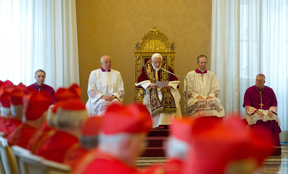 Pope Benedict XVI reads his resignation in Latin during a meeting of cardinals at the Vatican Feb. 11, 2013. (CNS/Vatican Media)