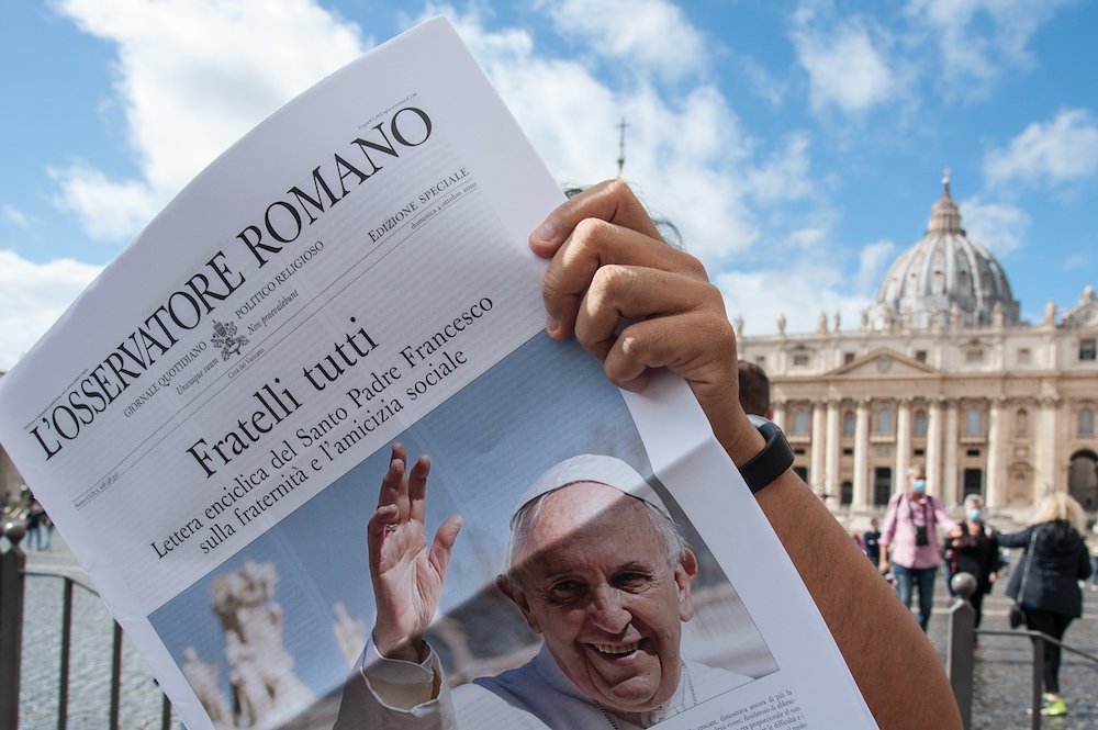Free copies of the Vatican newspaper L'Osservatore Romano with the front page about Pope Francis' encyclical, " 'Fratelli Tutti,' on Fraternity and Social Friendship," are distributed by volunteers at the end of the Angelus in St. Peter's Square at the Va Free copies of the Vatican newspaper L'Osservatore Romano with the front page about Pope Francis' encyclical, " 'Fratelli Tutti,' on Fraternity and Social Friendship," are distributed by volunteers at the end of the Angelus in St. Peter's Square at the Va