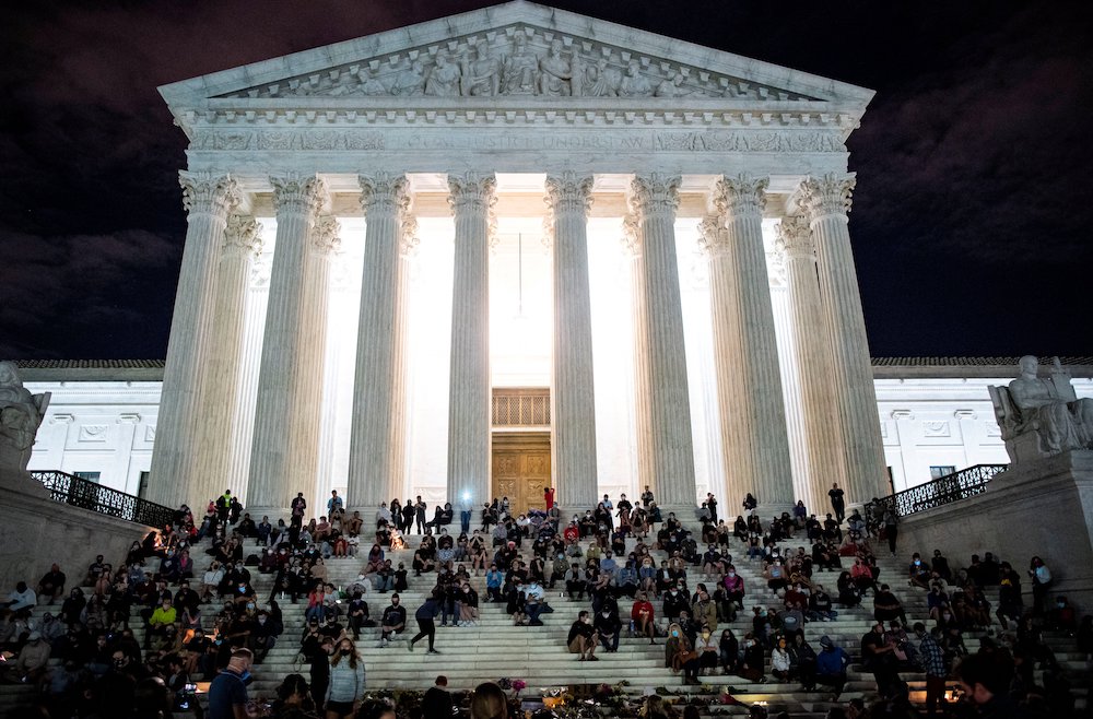 People in Washington gather in front of the U.S. Supreme Court following the death of Supreme Court Justice Ruth Bader Ginsburg, 87, Sept. 18. (CNS/Reuters/Al Drago)