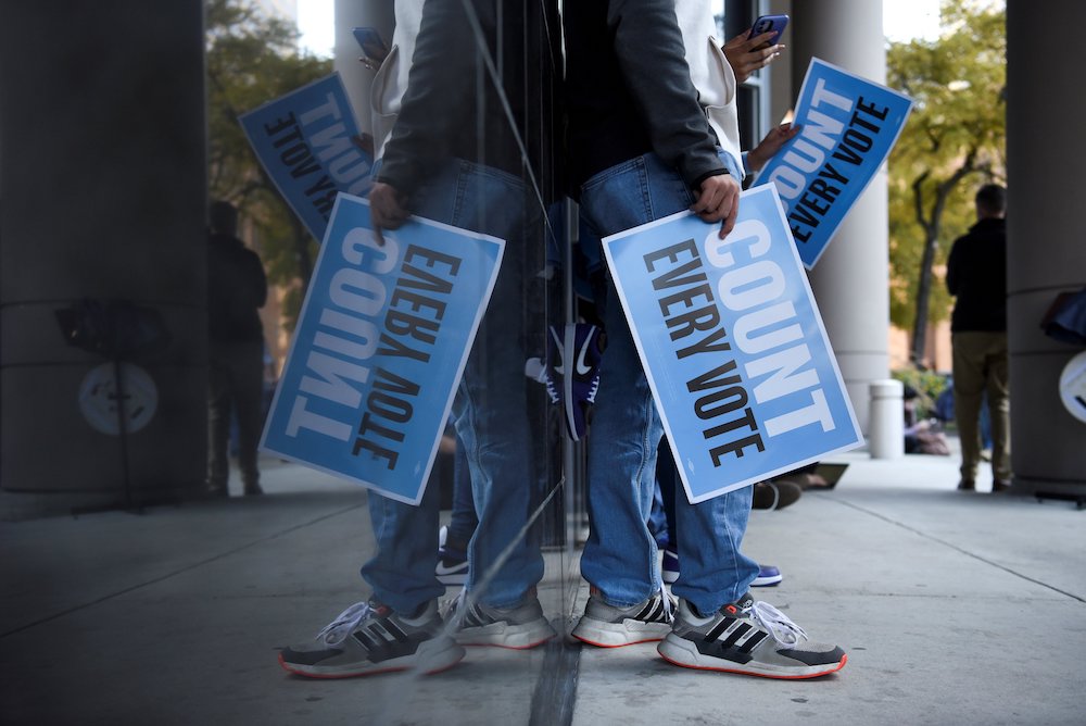 People in Houston gather to protest outside of a federal courthouse Nov. 2, where a judge rejected a GOP bid to throw out ballots cast at drive-through polling locations. (CNS/Reuters/Callaghan O'Hare) People in Houston gather to protest outside of a federal courthouse Nov. 2, where a judge rejected a GOP bid to throw out ballots cast at drive-through polling locations. (CNS/Reuters/Callaghan O'Hare)
