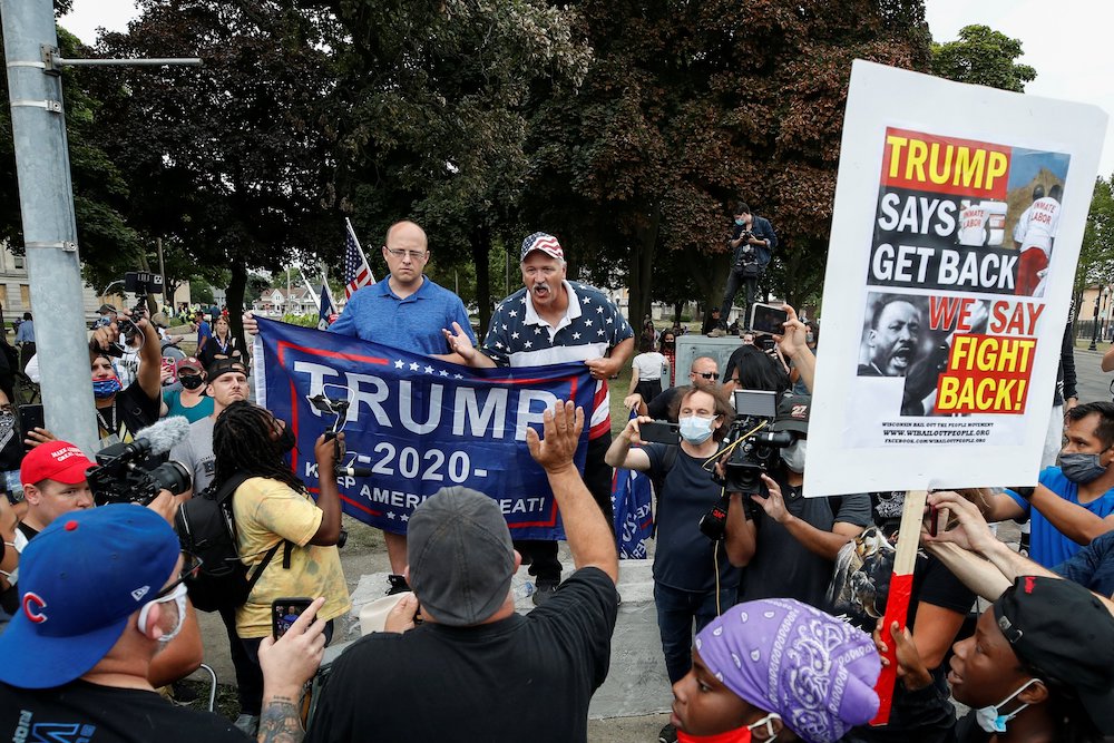 A Trump supporter in Kenosha, Wisconsin, exchanges words with protesters Sept. 1, during President Donald Trump's visit there. (CNS/Reuters/Kamil Krzaczynski) A Trump supporter in Kenosha, Wisconsin, exchanges words with protesters Sept. 1, during President Donald Trump's visit there. (CNS/Reuters/Kamil Krzaczynski)
