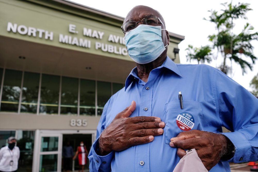 A man in Miami exits a polling station Oct. 19, as early voting began ahead of the November election. (CNS/Reuters/Maria Alejandra Cardona)