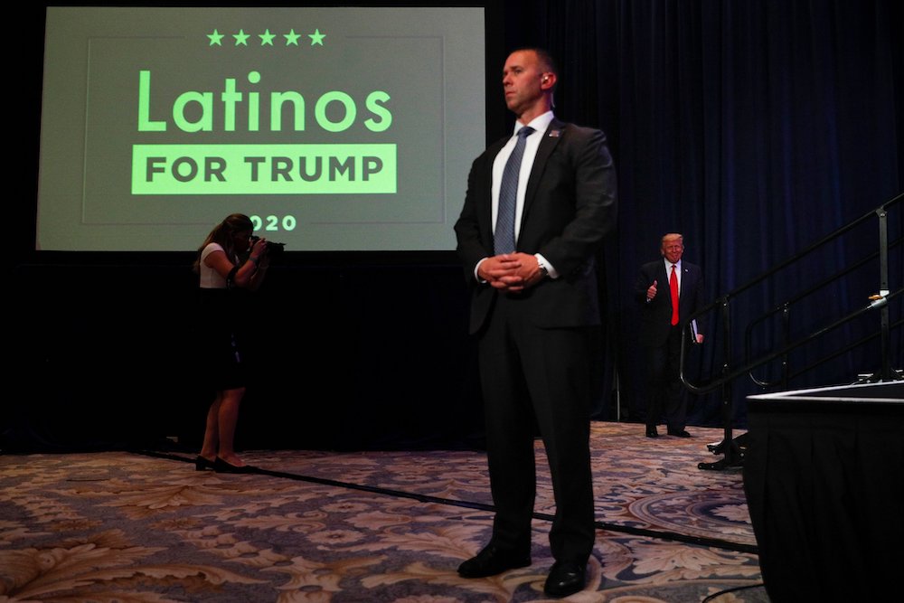 President Donald Trump, right, walks on stage before delivering remarks during a Latinos For Trump campaign event at the Trump National Doral Miami resort in Doral, Florida, Sept. 25, 2020. (CNS/Reuters/Tom Brenner) President Donald Trump, right, walks on stage before delivering remarks during a Latinos For Trump campaign event at the Trump National Doral Miami resort in Doral, Florida, Sept. 25, 2020. (CNS/Reuters/Tom Brenner)