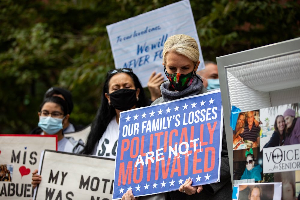 Grieving family members hold a mock funeral in the Brooklyn borough of New York City Oct. 18 to protest Gov. Andrew Cuomo's coronavirus restrictions that they say led to the deaths of their loved ones in nursing homes. (CNS/Reuters/Jeenah Moon)