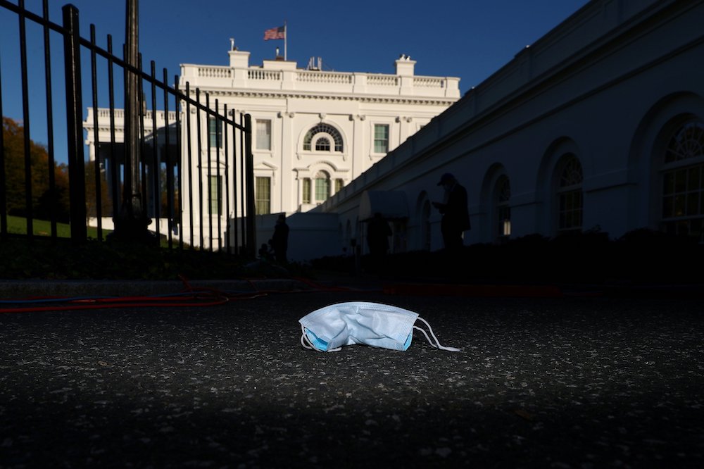 A used protective face mask litters the North Lawn Driveway at the White House in Washington Nov. 4. (CNS/Reuters/Tom Brenner)